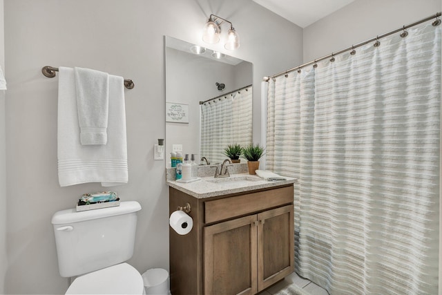 full bath with toilet and vanity