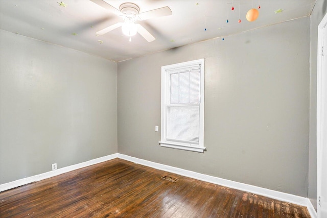 empty room featuring wood-type flooring and ceiling fan