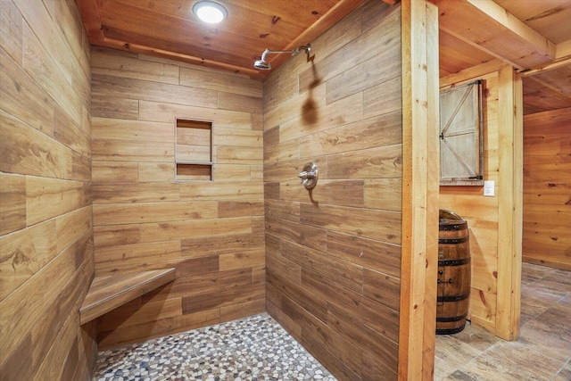 bathroom featuring wood walls, wooden ceiling, and walk in shower