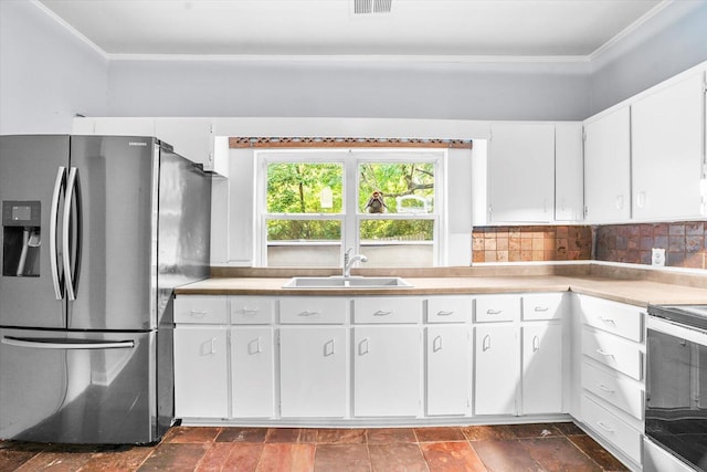 kitchen featuring sink, ornamental molding, appliances with stainless steel finishes, tasteful backsplash, and white cabinetry