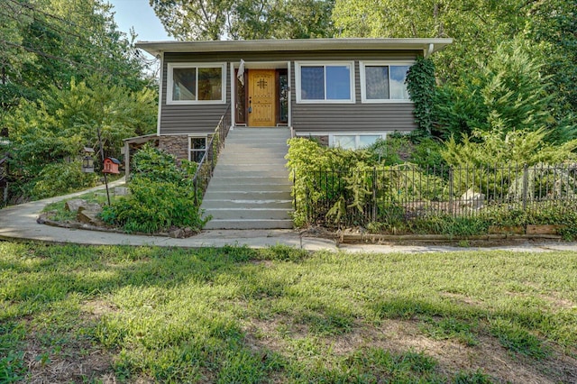 view of front of home with a front lawn