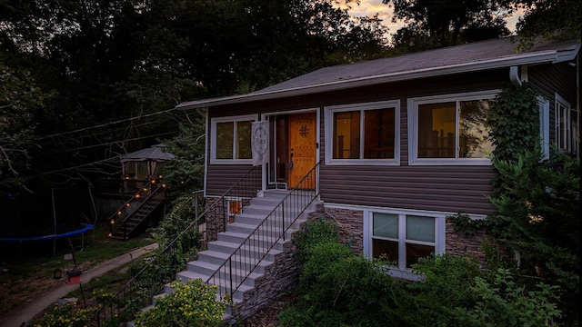 view of front of property featuring a trampoline