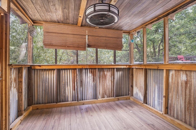 unfurnished sunroom with wooden ceiling