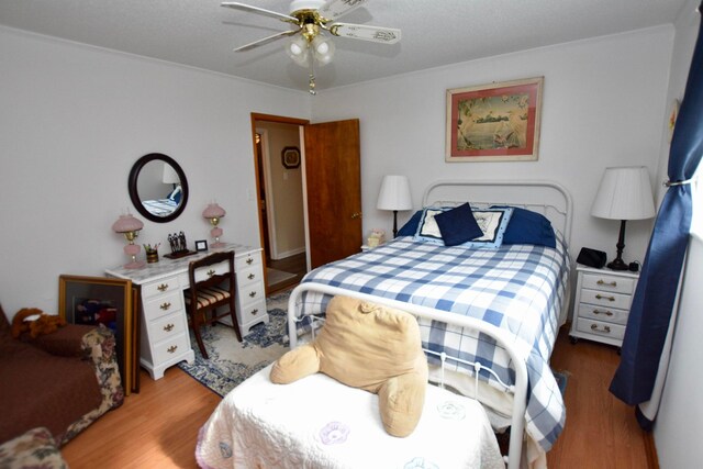 bedroom featuring light hardwood / wood-style flooring and ceiling fan