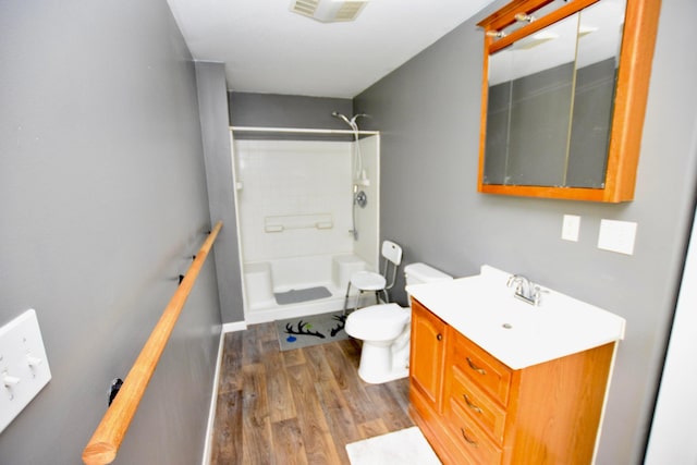 bathroom featuring hardwood / wood-style floors, vanity, and toilet