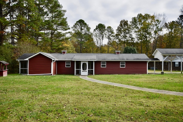 ranch-style home with a front lawn