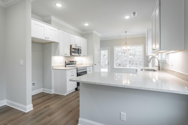 kitchen featuring light stone countertops, sink, white cabinetry, and stainless steel appliances