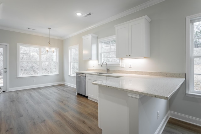 kitchen with dishwasher, sink, crown molding, white cabinets, and hardwood / wood-style flooring