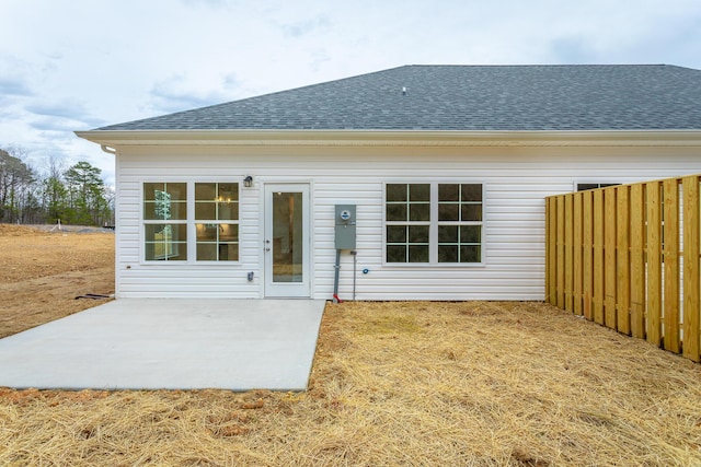 back of property with a patio