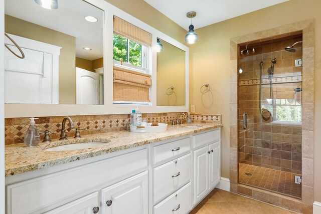 302 Key Cove Rd, Spring City, TN 37381 - bathroom featuring a sink, backsplash, and a stall shower