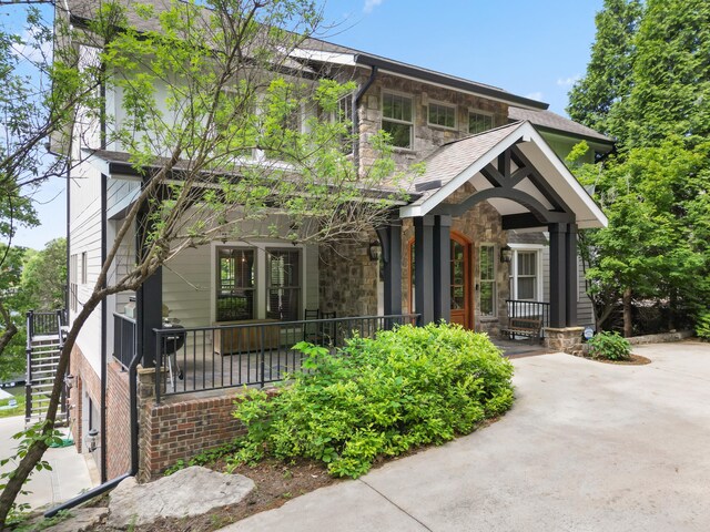 302 Key Cove Rd, Spring City, TN 37381 - craftsman-style home featuring a porch and stone siding