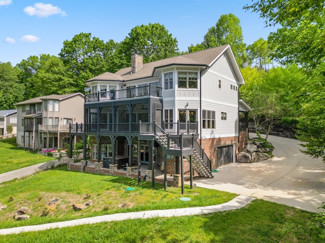 302 Key Cove Rd, Spring City, TN 37381 - back of property with a garage, a balcony, a chimney, stairs, and driveway