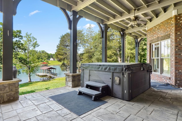 302 Key Cove Rd, Spring City, TN 37381 - view of patio with a ceiling fan, a water view, and a hot tub