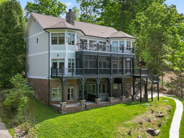302 Key Cove Rd, Spring City, TN 37381 - back of house featuring a deck, a sunroom, a patio area, a hot tub, and stairway