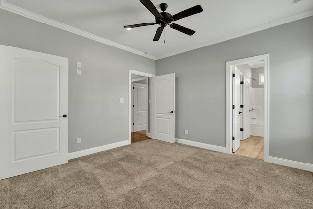 unfurnished bedroom with crown molding, light colored carpet, ceiling fan, and ensuite bath