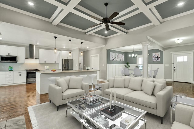 living room featuring sink, coffered ceiling, and dark wood-type flooring