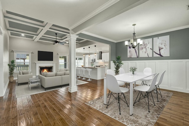 dining room with beamed ceiling, coffered ceiling, ceiling fan with notable chandelier, and dark hardwood / wood-style floors