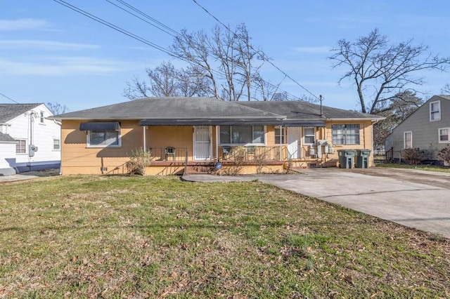 604 N Moore Rd, Chattanooga, TN 37411 - view of front facade featuring a porch, a front yard, roof with shingles, and concrete driveway