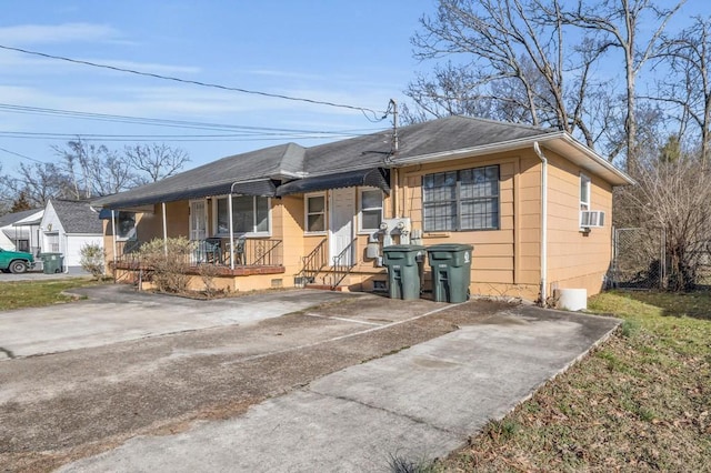 604 N Moore Rd, Chattanooga, TN 37411 - view of front of house featuring a porch, cooling unit, and a shingled roof