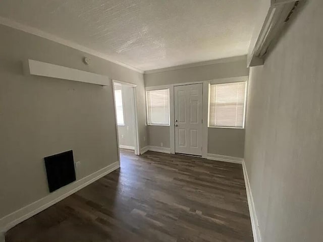 604 N Moore Rd, Chattanooga, TN 37411 - unfurnished room featuring dark wood-style floors, ornamental molding, and a textured ceiling