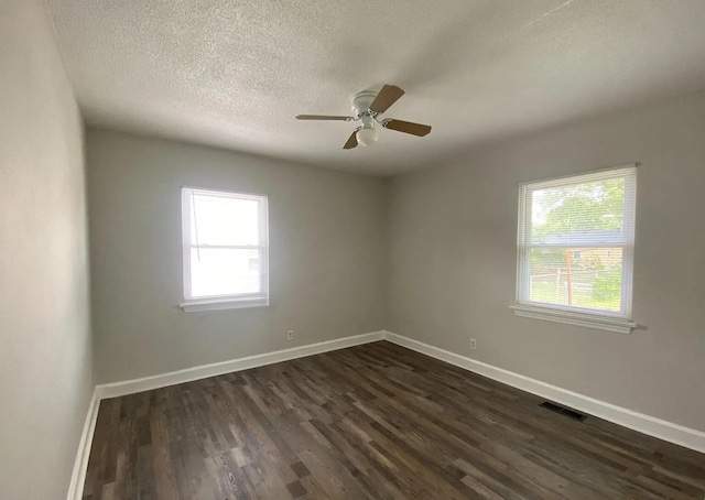604 N Moore Rd, Chattanooga, TN 37411 - unfurnished room with plenty of natural light, dark wood finished floors, ceiling fan, and a textured ceiling