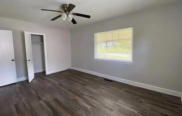 604 N Moore Rd, Chattanooga, TN 37411 - unfurnished bedroom with dark wood-type flooring, a closet, and a ceiling fan