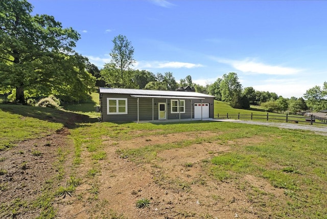 1295 Ideal Valley Rd, Spring City, TN 37381 - ranch-style home with an attached garage, driveway, and metal roof