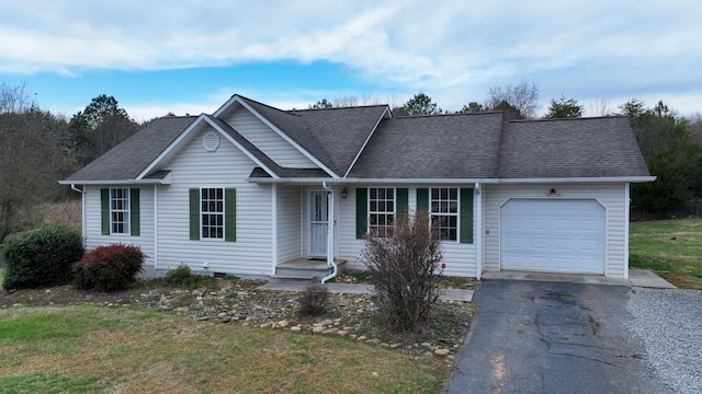 ranch-style house featuring an attached garage, driveway, and roof with shingles