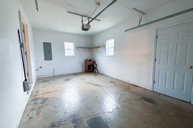 garage featuring electric panel and a garage door opener