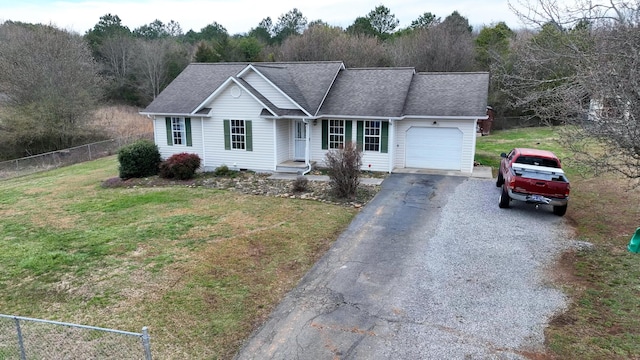 single story home with fence, driveway, roof with shingles, an attached garage, and a front lawn