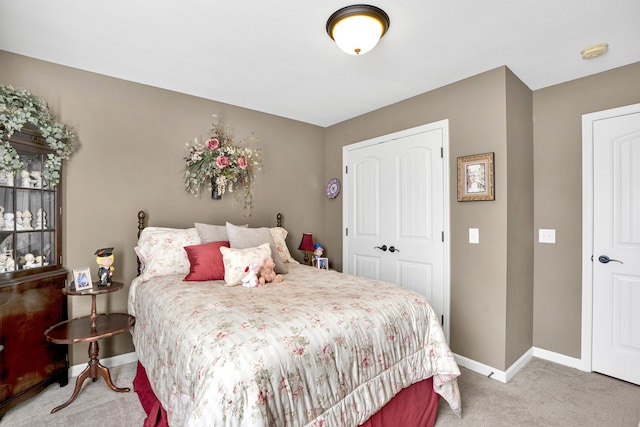 carpeted bedroom featuring a closet