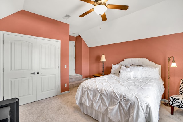 carpeted bedroom featuring ceiling fan and lofted ceiling