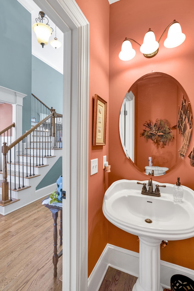 bathroom with hardwood / wood-style floors