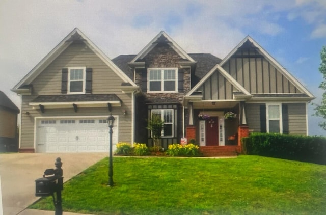 craftsman-style home with a garage and a front yard