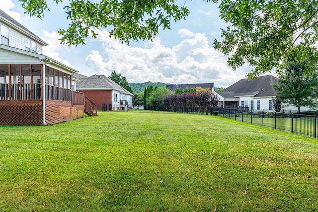 view of yard featuring a sunroom