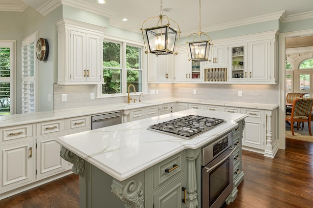 kitchen featuring white cabinets, an inviting chandelier, a sink, stainless steel appliances, and dark wood-style floors