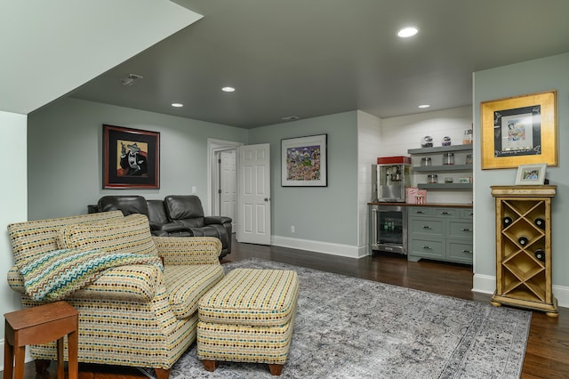 living area with dark wood-style flooring, baseboards, a bar, wine cooler, and recessed lighting