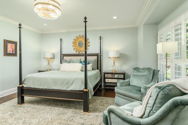 bedroom with wood finished floors, a notable chandelier, and multiple windows