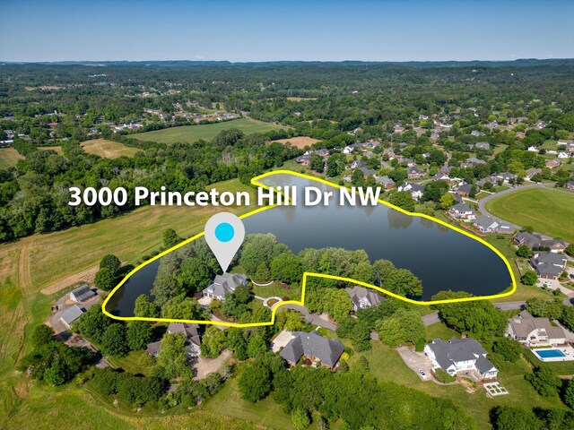 drone / aerial view with a residential view and a water view
