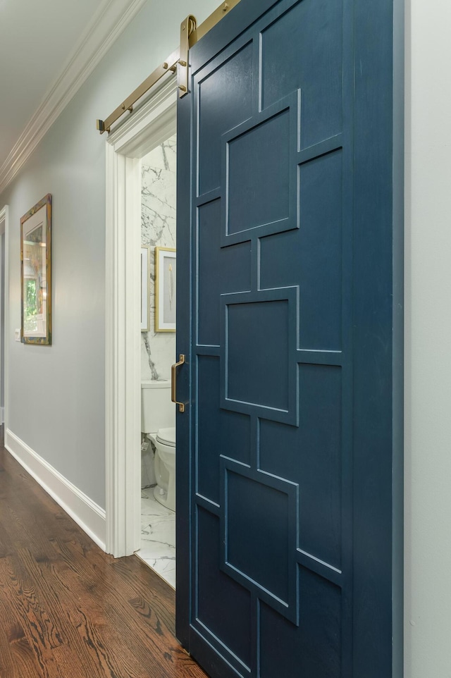 interior space with baseboards, ornamental molding, and marble finish floor