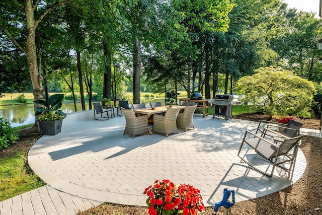 surrounding community featuring outdoor dining area and a patio area