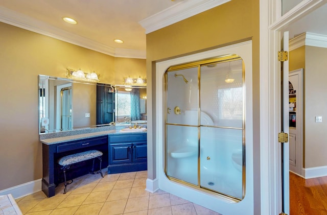 bathroom featuring tile patterned flooring, a shower stall, vanity, and crown molding