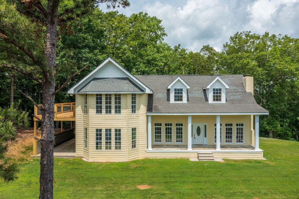 201 Payne Mountain Rd, Tellico Plains, TN 37385 - view of front of home with a front lawn, a shingled roof, a chimney, and covered porch