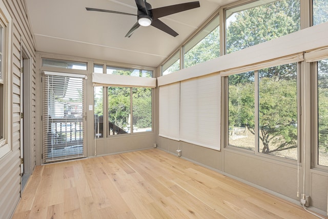 unfurnished sunroom with ceiling fan and lofted ceiling