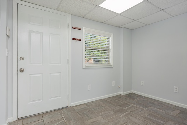 spare room with a drop ceiling