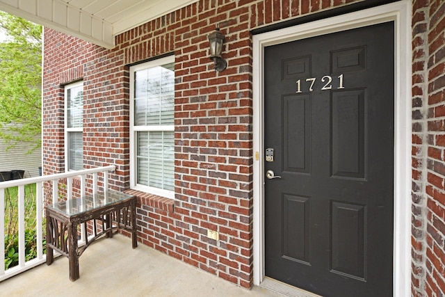 entrance to property featuring a porch