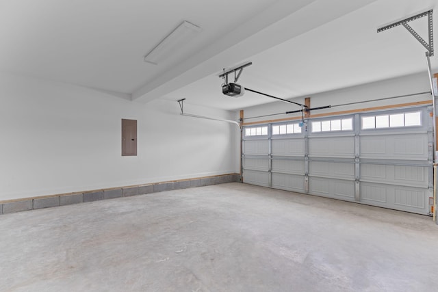 garage featuring electric panel and a garage door opener