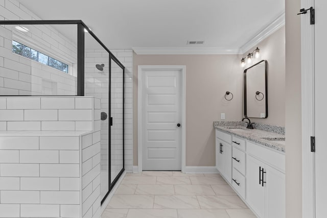 bathroom with vanity, an enclosed shower, and ornamental molding