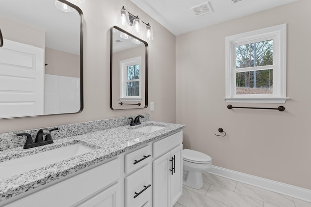 bathroom with vanity and toilet