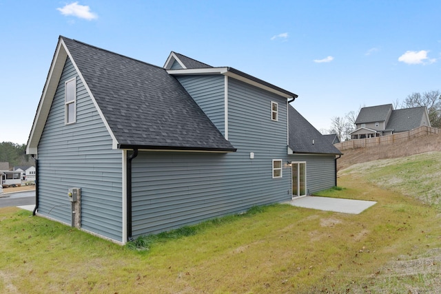 view of property exterior with a lawn